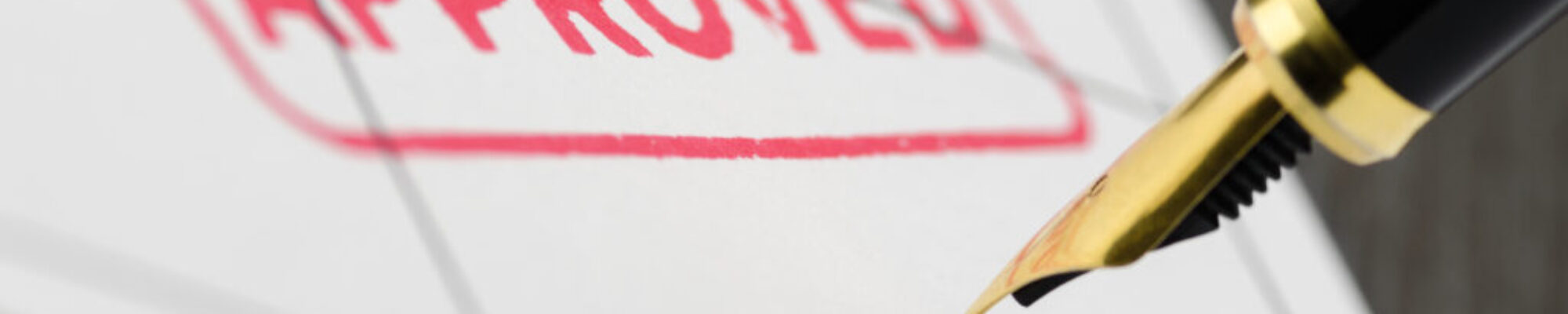 Application signed, fountain pen and stamp approved, close up shot. Application signed, fountain pen and stamp approved, close up shot.